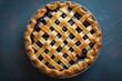 © anatolir - Overhead view of a freshly baked berry pie featuring a golden lattice crust on a dark background