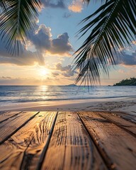 Wall Mural - empty wooden table on tropical beach at sunset