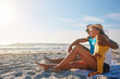 © ReadyAtTheEase/peopleimages.com - Couple, picnic and hug at beach with sunglasses, sunshine and relax for vacation by ocean in summer. Man, woman and happy on sand in Miami with blue sky, sun and partner on date for holiday or love
