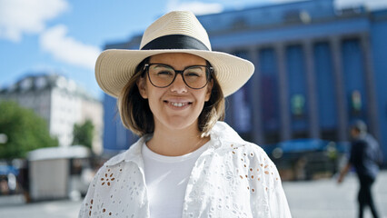 Sticker - Beautiful young hispanic woman smiling confident wearing summer hat at Nobel prize building