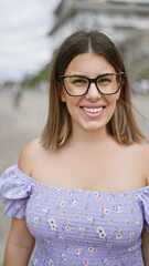 Canvas Print - Cheerful latin beauty in glasses, a brunette woman poses with a confident and carefree smile at osaka's famous castle, overflowing with joy and happiness in japan's heritage tourism