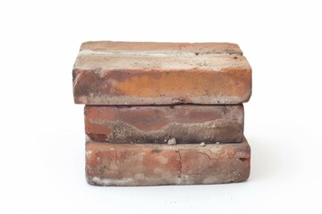 Three weathered red bricks with visible textures, stacked on top of each other isolated on a white background