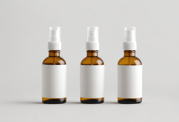 Wall Mural - Three amber glass bottles of spray for medicine health cosmetic self cleaning product with empty blank white sticker area for brand logo. Glass container for liquid. Mock-up mockup concept