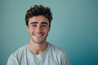 © MagnusCort - A close up portrait of a young man with a subtle smile