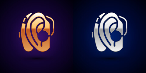 Sticker - Gold and silver Hearing aid icon isolated on black background. Hearing and ear. Vector