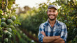 © Miljan Živković - Man farmer young adult caucasian stand in the orchard apple