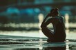 © spyrakot - Contemplative Rower Reflecting by Sunlit Water After Olympic Race - Sport, Athletics, and Determination