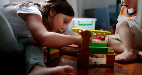 Children playing with toys, little sister and toddler