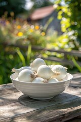 Wall Mural - fresh white onion in a bowl in a white bowl on a wooden table. Selective focus