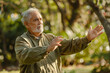 © AI_images - a Hispanic retired man practicing tai chi in a park
