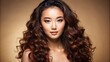 © DigitalArt Max - Vibrant isolated beige background featuring a stunning asian beauty's captivating portrait with luscious curly long hair, radiant glowing face, and flawless healthy skin.