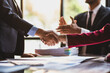 © Wasan - Handshake, Business cooperation at a meeting of business people. Business partners shaking hands in a meeting.