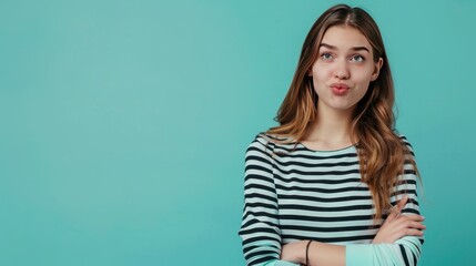 Photo portrait of attractive young woman look point empty space dressed stylish striped clothes isolated on aquamarine color background  