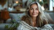 © fotofabrika - Smiling Woman With Silver Hair Relaxing on a Sofa