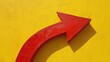 © LukaszDesign - Curvy Red Arrow Against a Yellow Backdrop