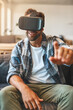 © peopleimages.com - Excited, man and virtual reality headset in home lounge of cyber experience, metaverse system or gaming connection. .Gamer, VR or games in living room with future, innovation and ui app technology
