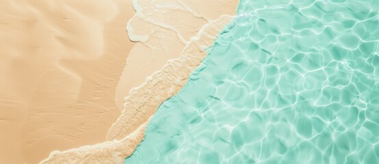  Gentle turquoise ocean meets golden sand on sunny beach, creating serene summer atmosphere. Colors and textures evoke tranquility, perfect for vacation escape