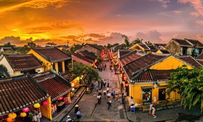 Wall Mural - The ancient city of Hoi An in Vietnam at sunset, with colorful lanterns and bustling crowds, bird'seye view