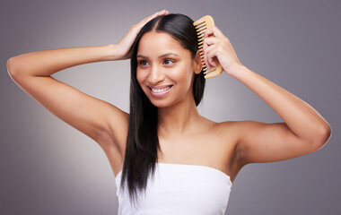 Sticker - Hair care, thinking and woman in studio with comb for grooming, scalp treatment or keratin on gray background. Hairstyle, brushing and hands of model for satisfaction, cosmetics or salon shine