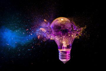 Fototapete - Colorful light bulb exploding