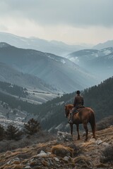 Canvas Print - A person riding a horse at the summit of a mountain, offering breathtaking views