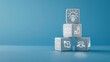 © Robert - Business strategy icons research idea and development on three white cube blocks isolated on blue background