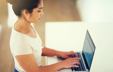 Canvas Print - Woman, laptop and research in office for proposal, planning and employee at desk for digital report. Female person, networking and professional for project management, online and website for ideas