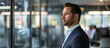 © mittpro - An executive in a sleek, glass-walled office, engaged in a video conference call