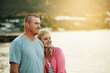 © C Pendl�/peopleimages.com - Love, sunset and couple by water with hug for summer vacation together and commitment for marriage support. Man, woman and embrace with smile for sea travel and ocean holiday adventure in Amsterdam