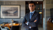 © Sadia - Businessman in formal attire standing indoors