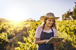 © Lyndon/peopleimages.com - Tablet, farmer and happy woman research plants for sustainability or agriculture outdoor at field. Digital technology, farm and person at countryside for planning food production, harvest or growth