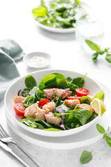Wall Mural - Salmon salad with fresh spinach, tomato and green pepper, top view