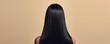 © cac_tus - Woman with long sleek black hair shown from the back, minimalist beauty concept
