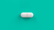 © garrykillian - White single pill isolated on a turquoise background. Tablet, pill capsule top view, flat lay. 3d render illustration