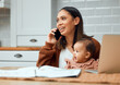© peopleimages.com - Phone call, mother and baby in kitchen with laptop, documents and work from home with kid. Woman, child and technology in apartment for online, communication and conversation for job or career