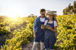 © Lyndon/peopleimages.com - Tablet, farm and happy couple in discussion for agriculture sustainability or growth outdoor at field. Farmer, man and woman on digital technology for planning food production, plant harvest and agro