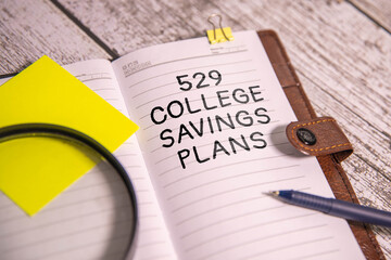 529 College Saving Plans text on the cart. Business and finance concept