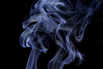 Wall Mural - Close up of incense smoke abstract on black background