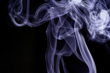 Wall Mural - close up of incense smoke abstract on black background