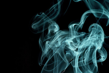 Wall Mural - Close up of incense smoke abstract on black background