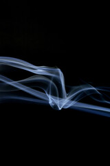 Wall Mural - close up of incense smoke abstract on black background