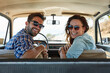 © peopleimages.com - Portrait, couple and driving in car for vacation, road trip and destination location with smile. Vehicle, transport and married people with happiness for journey, adventure and travel for bonding