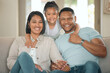 © peopleimages.com - Family, portrait and happy for relax, love and trust in home living room with mother, father and child. Parents, kid and smile as household for care, bond or support together in house lounge on sofa