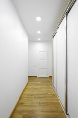 Wall Mural - White interior door with sliding wardrobe in the hallway