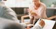 © peopleimages.com - Psychology, therapist and hands or counseling with writing in consultation for mental health support and therapy. Psychologist, patient or expert advice for depression, anxiety or stress on clipboard