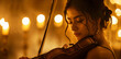 © nilanka - Charming Young woman playing violin in romantic candlelight room.