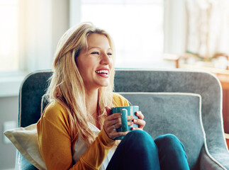 Wall Mural - Happy, coffee and woman on sofa in home for relaxing, chill and calm with drink, beverage and cappuccino. Smile, morning and person with cup, tea and mug in living room for wellness, rest and break