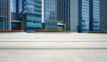 Wall Mural - Empty floor with modern office buildings in the background