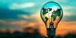 © Anastasiia - Light bulb silhouette against dusk sky with illuminated green world map symbolizes unity in renewable energy. Concept Renewable Energy Unity, Green World Map, Dusk Sky Silhouette