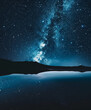 © ksu - A night sky with stars and a mountain in the background